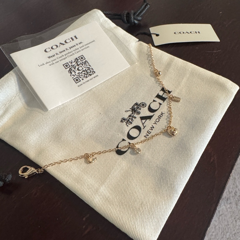 Coach Gold-Tone Heart Charm Bracelet with Mini Pendants - Picture 2 of 2